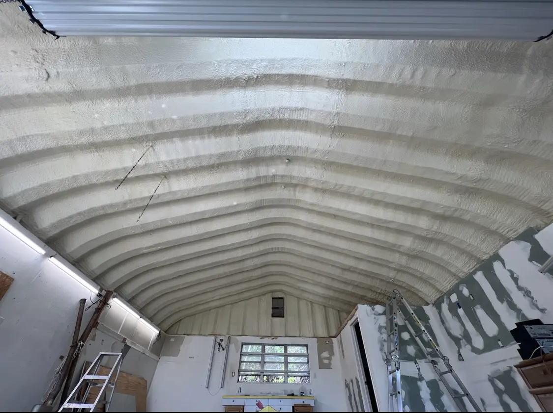 Spray polyurethane foam applied to the underside of a metal roof deck in North Auburn